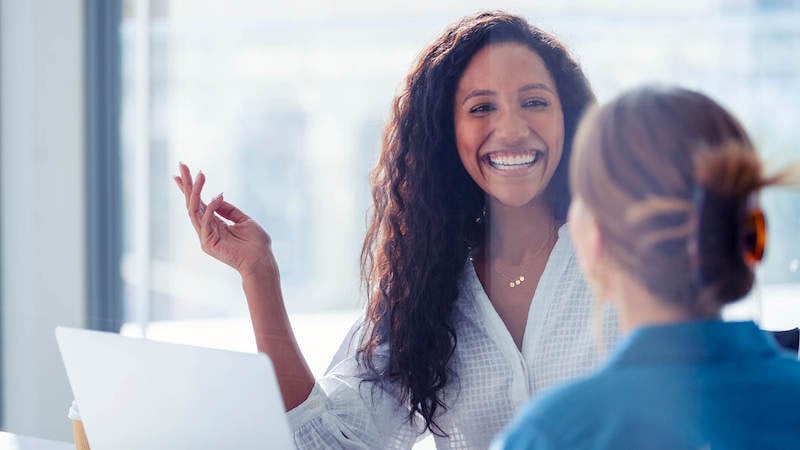 hr-coaching-woman-smiling-in-meeting